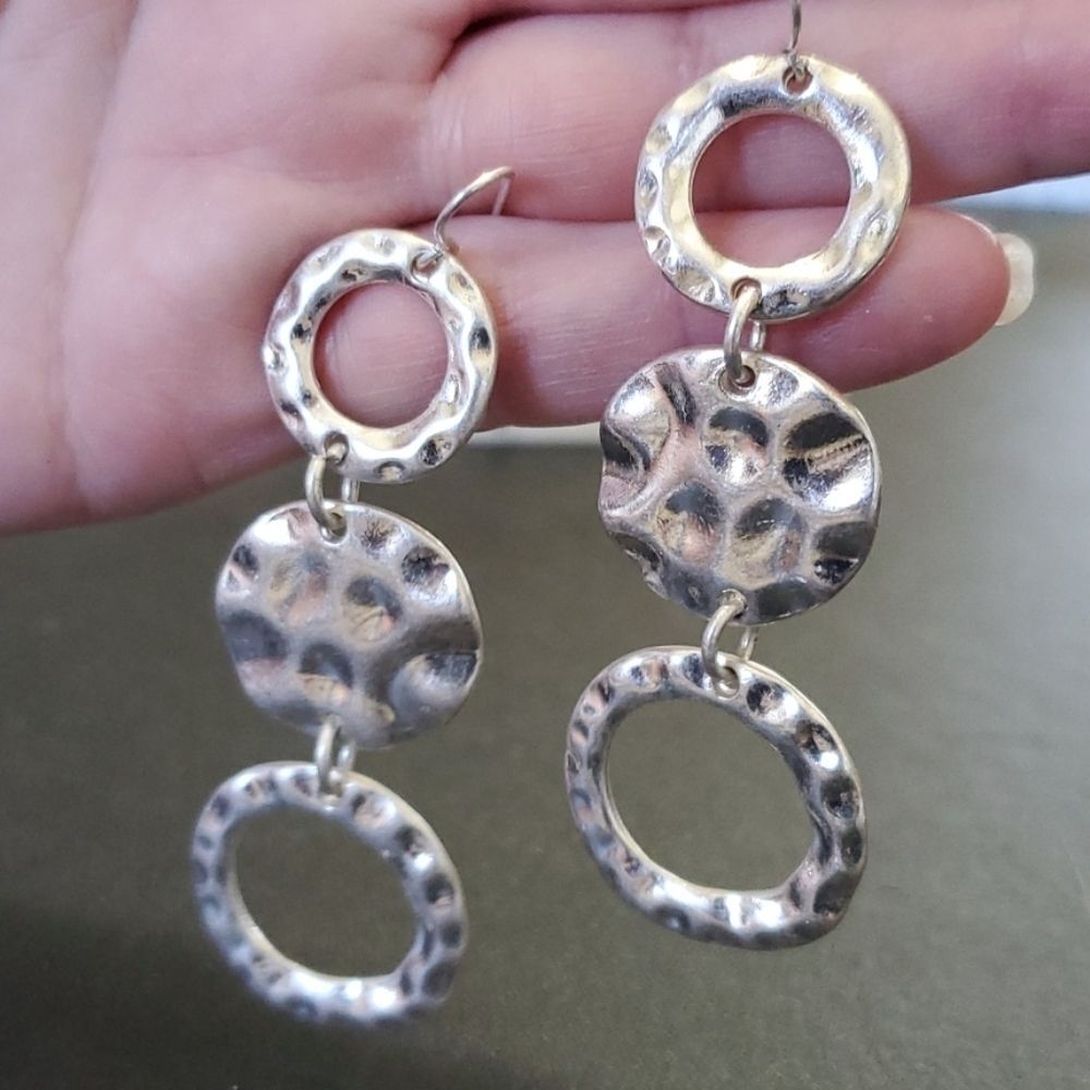 Silver tone textured dangling circle earrings